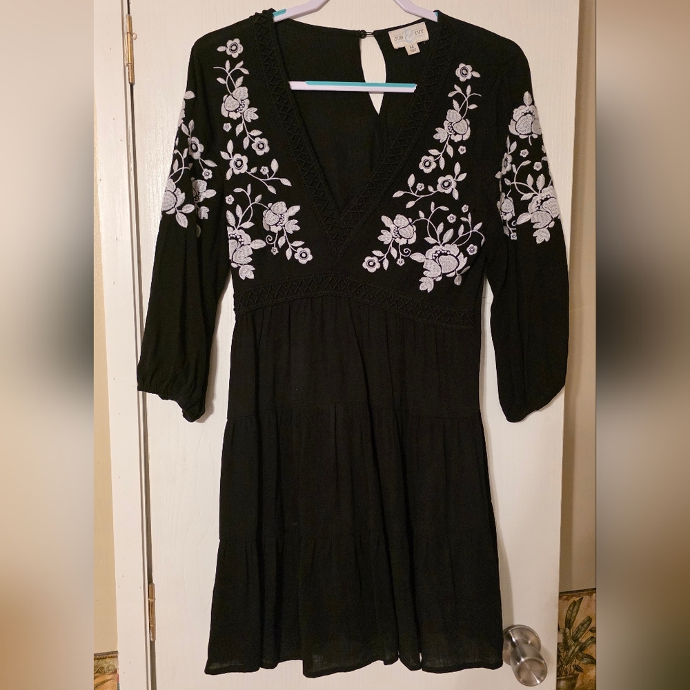 Elegant Black Dress with White Floral Detailing
